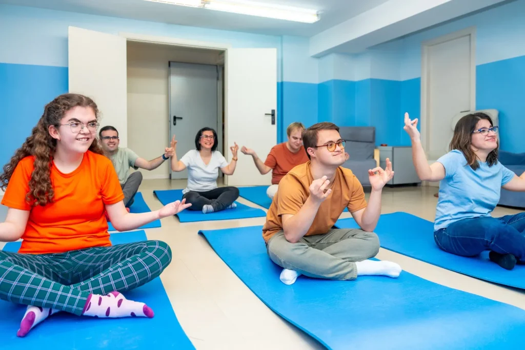 Disabled friends in yoga class