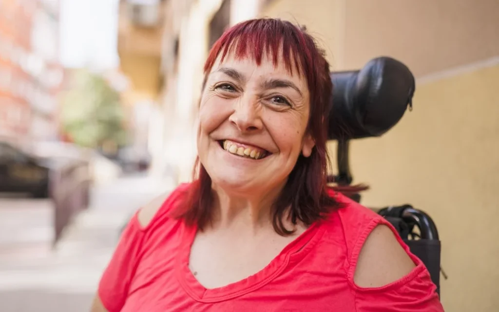 Disabled woman smiling at camera